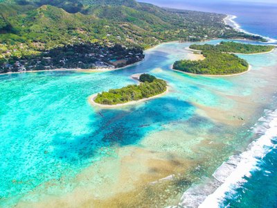 In Rarotonga, discover the serene and visually stunning underwater world of Muri Lagoon, where crystal clear waters and colorful coral reefs teem with marine life.