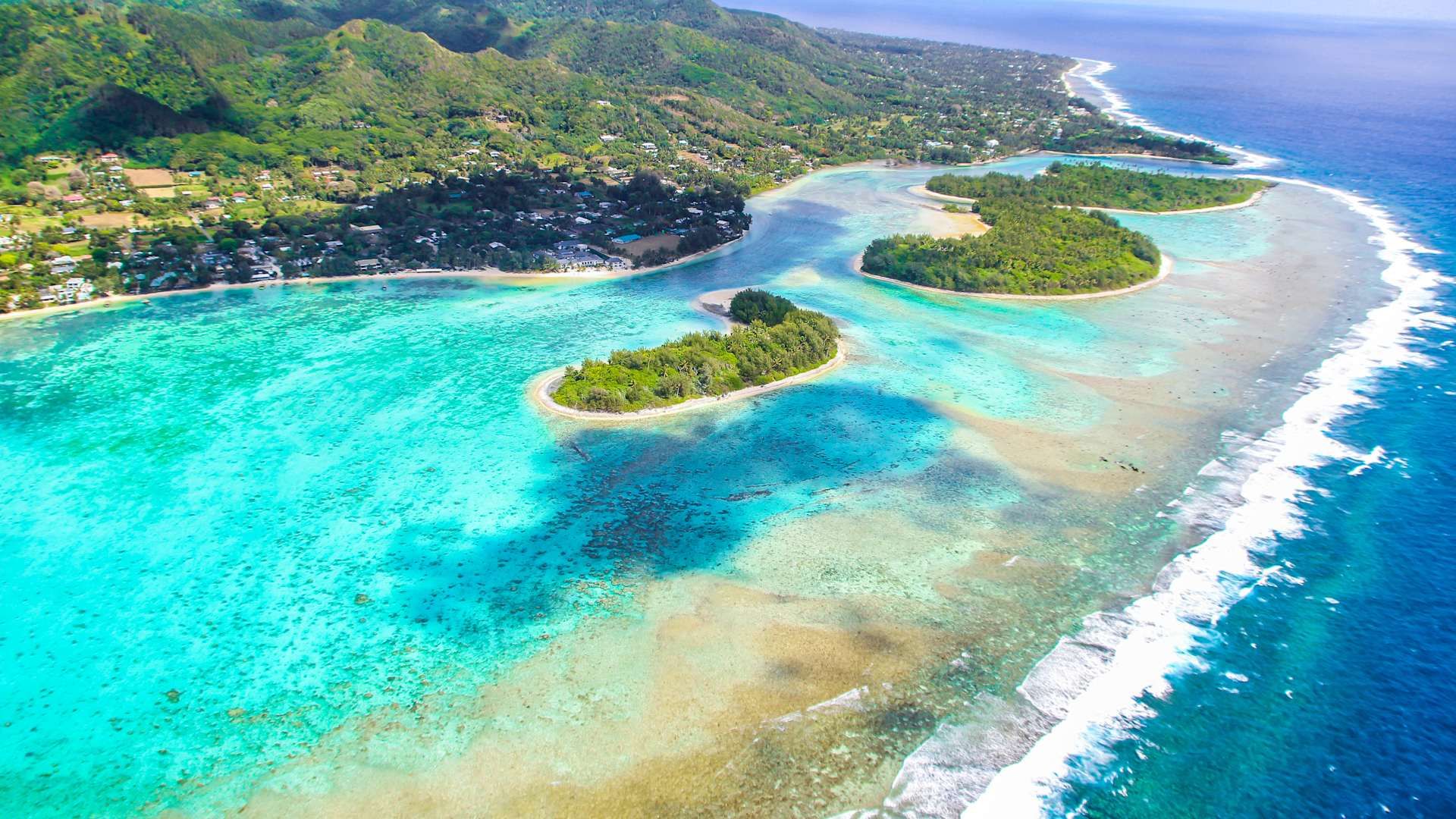 In Rarotonga, discover the serene and visually stunning underwater world of Muri Lagoon, where crystal clear waters and colorful coral reefs teem with marine life.